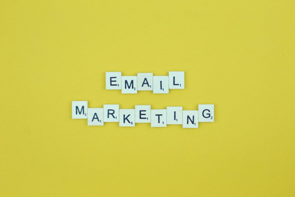 Email marketing- scrabble letters word on a yellow background